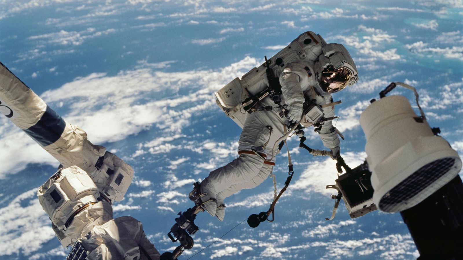 Astronauts shelter as Russian satellite shatters into over 100 pieces in space station incident.